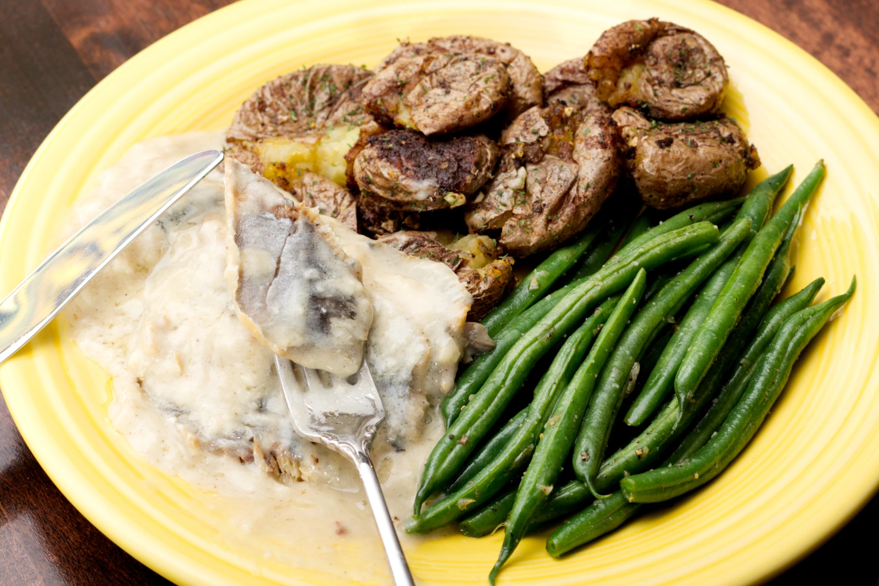 Contents poured out onto the plate with a piece on the fork