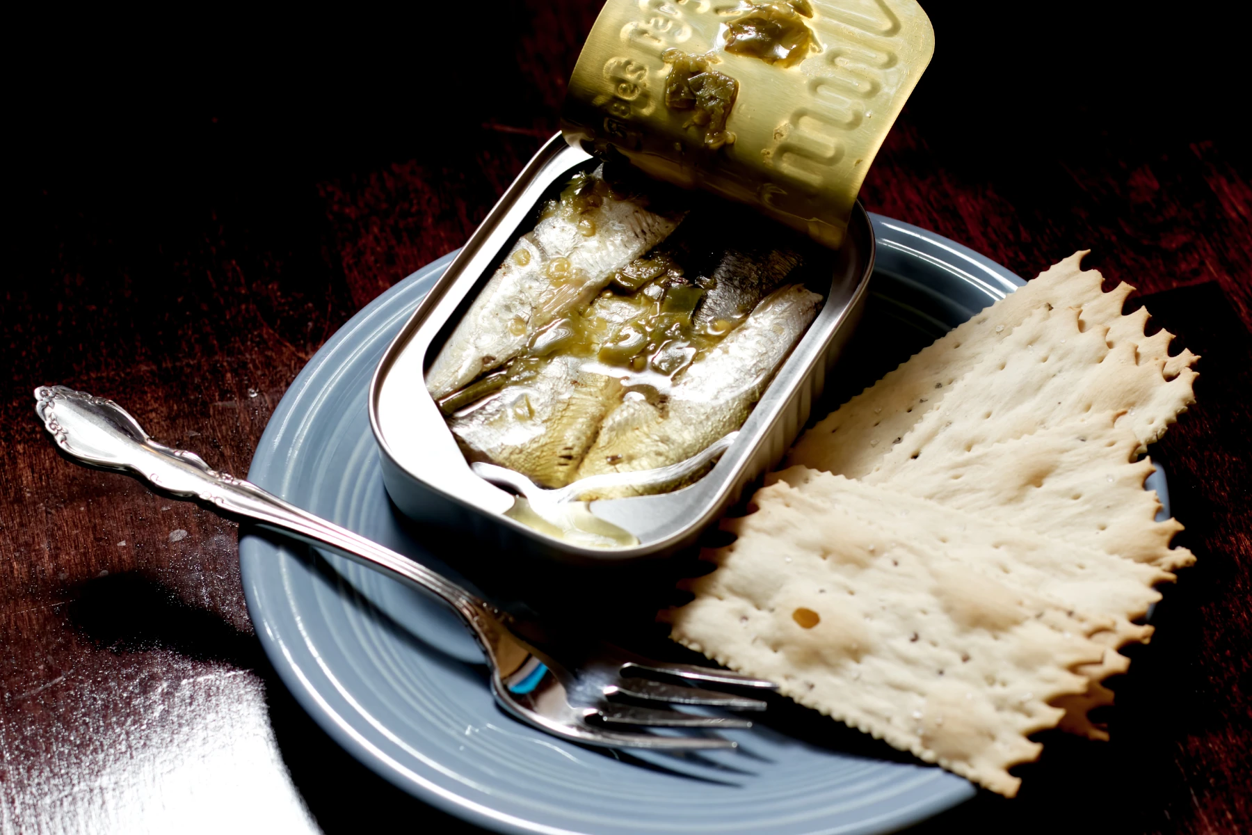 Tin opened with a side of crackers