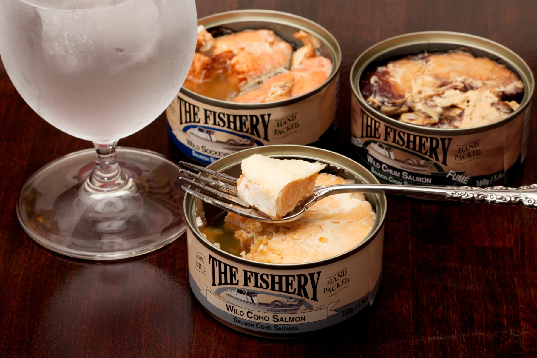 Coho salmon can, morsel on fork.