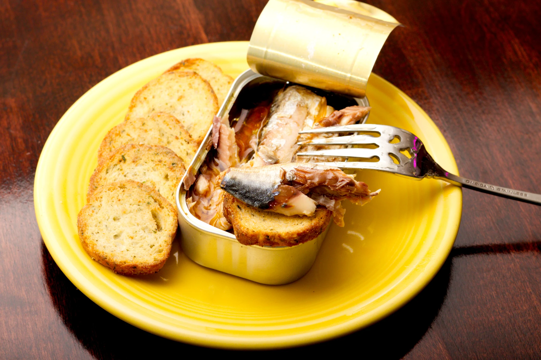 Morsel of fish on an individual cracker