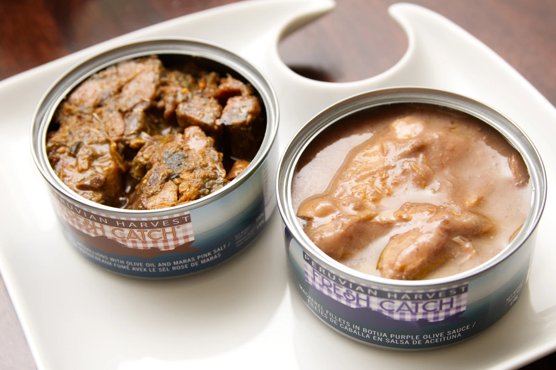 Opened cans of two different Peruvian Harvest tapas