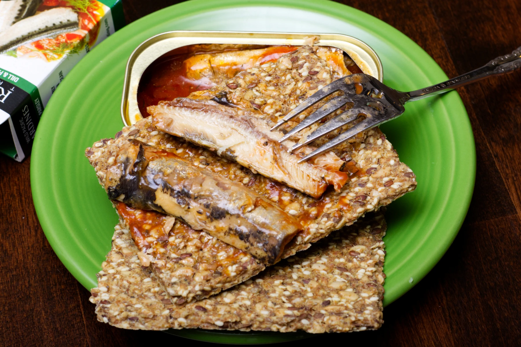 Sardine fillets on top of crispbread.