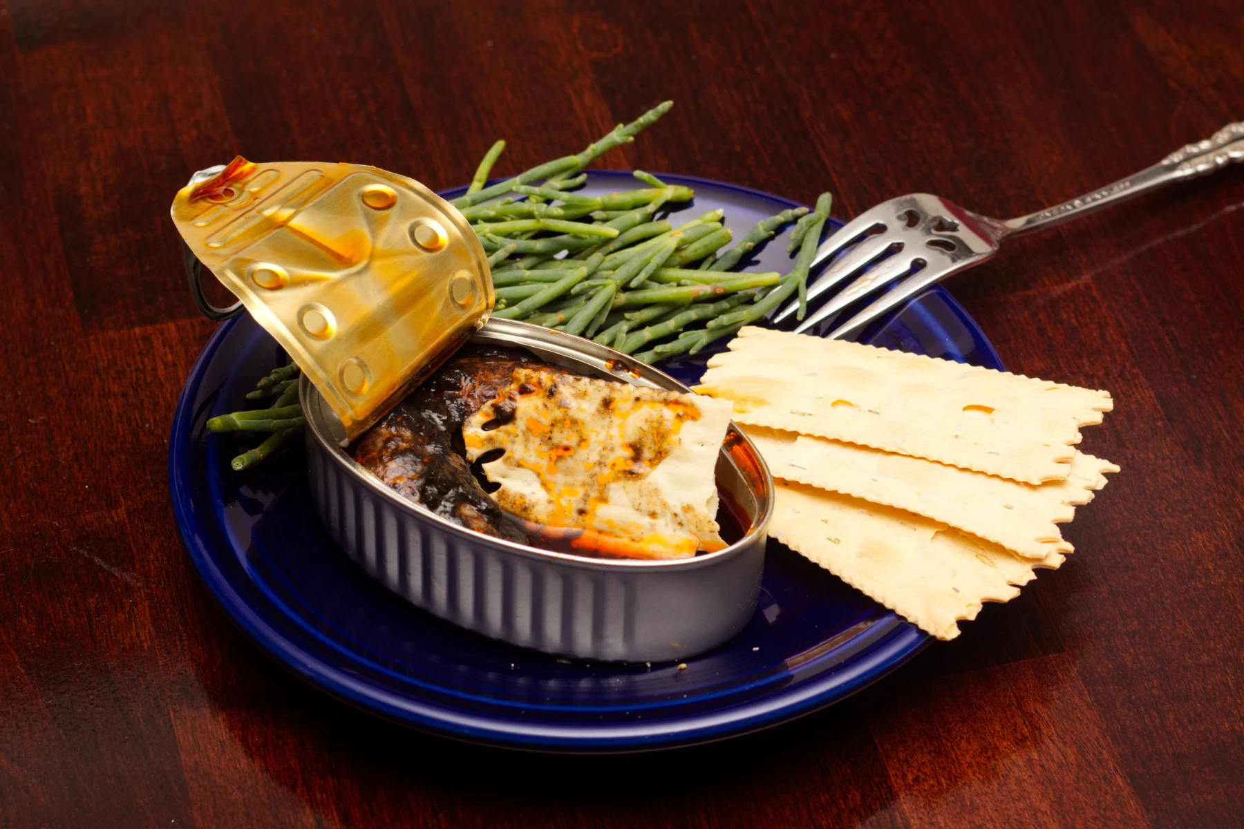 Cracker soaking in the sauce left on the bottom of the can.
